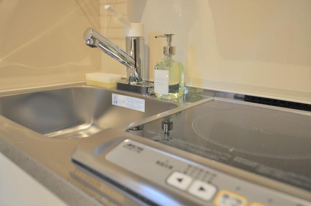 a kitchen sink with a faucet and a counter top at 原田屋Hotel 3F in Tokyo