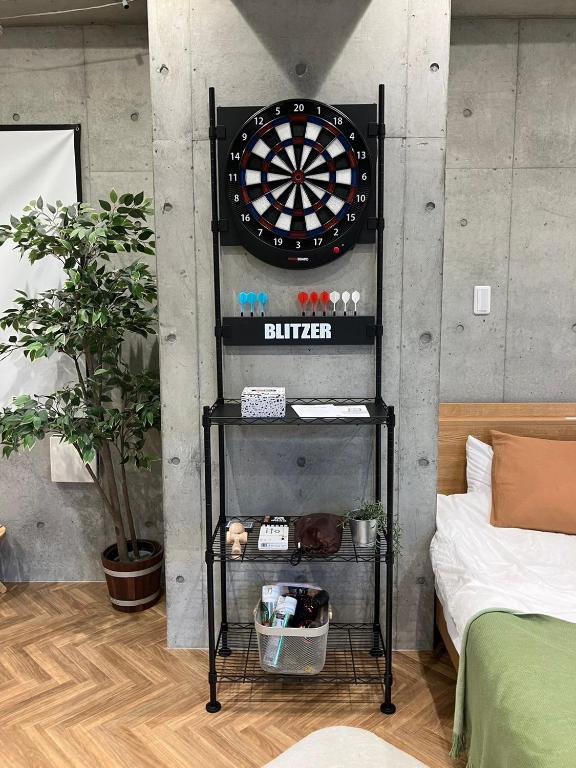 a dart board on a wall in a room at 原田屋Hotel 3F in Tokyo