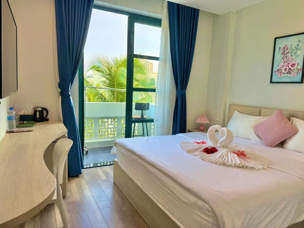 Postel nebo postele na pokoji v ubytování Minh Anh Hotel