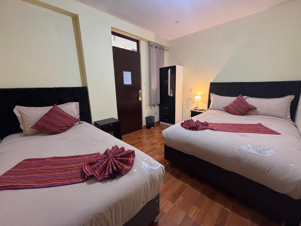 Postel nebo postele na pokoji v ubytování Valicha Casa Hotel