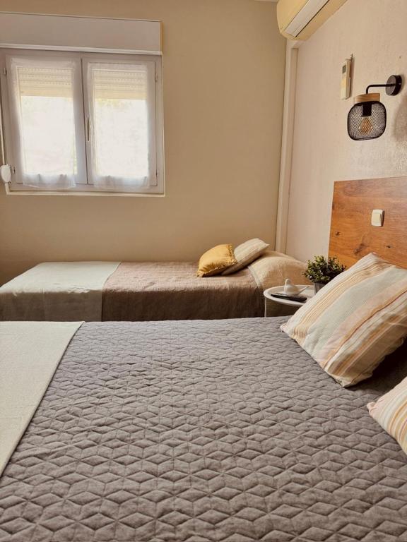 Postel nebo postele na pokoji v ubytování Hôtel le Nid