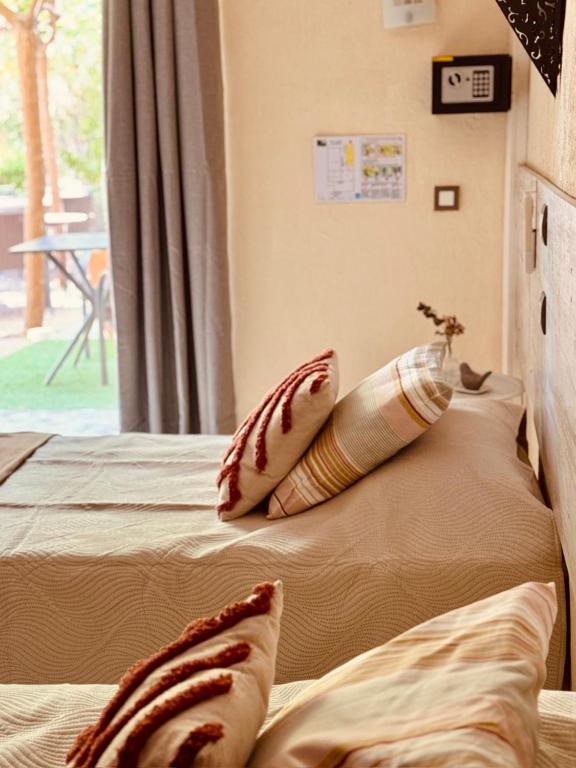 Postel nebo postele na pokoji v ubytování Hôtel le Nid