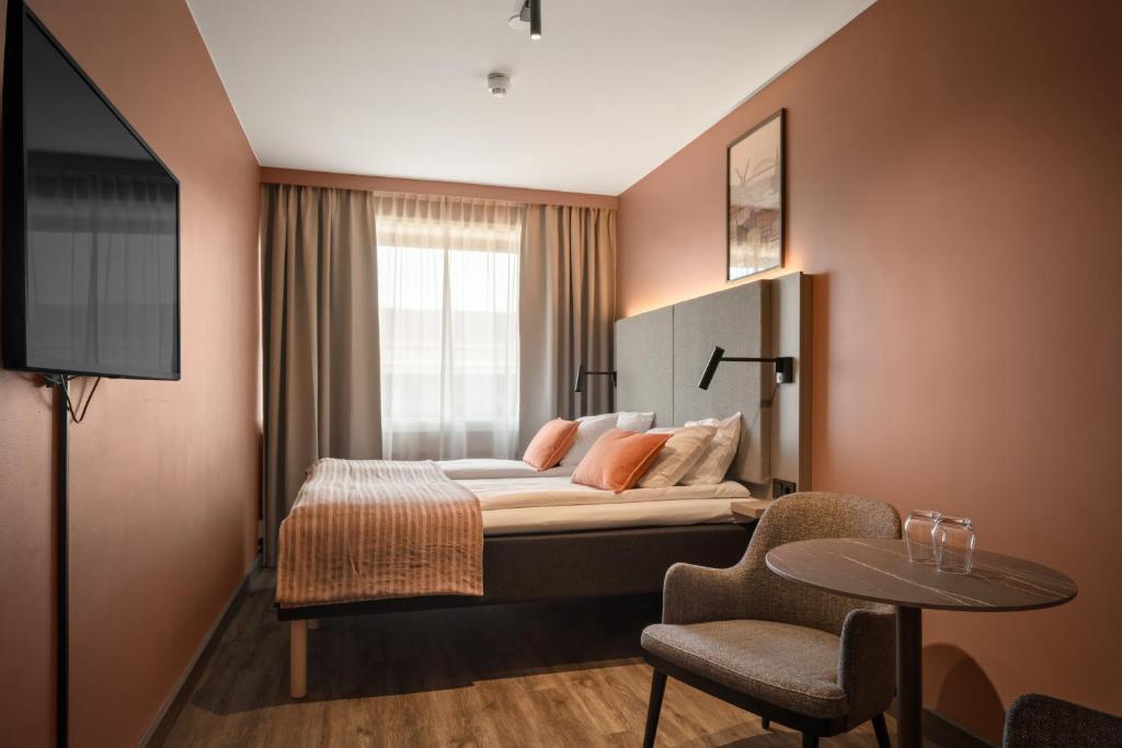 Postel nebo postele na pokoji v ubytování Scandic City