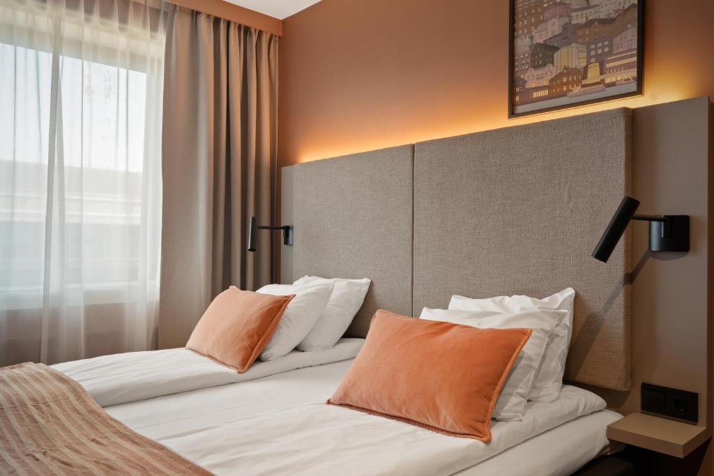 Postel nebo postele na pokoji v ubytování Scandic City