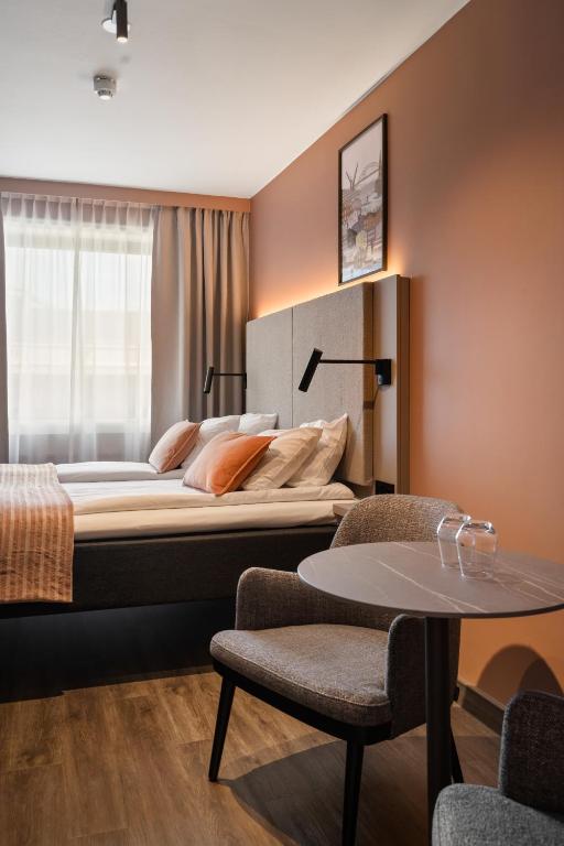 Postel nebo postele na pokoji v ubytování Scandic City