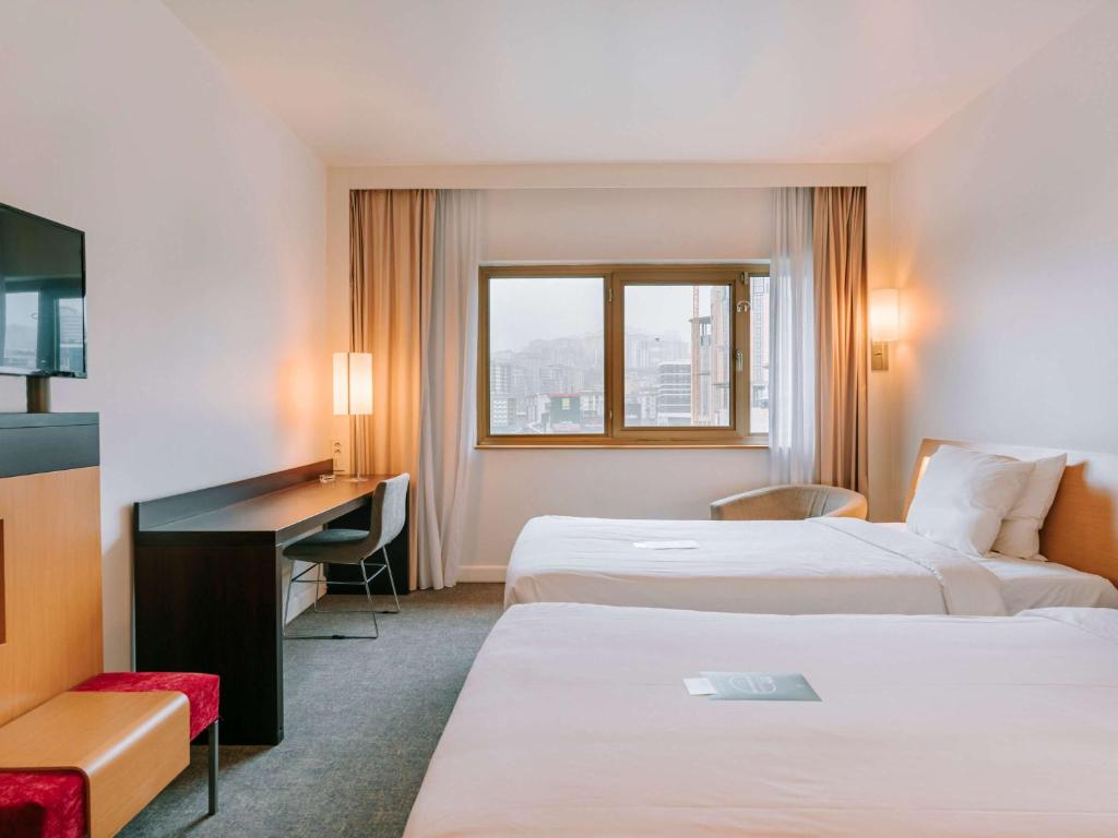 Postel nebo postele na pokoji v ubytování Novotel Trabzon