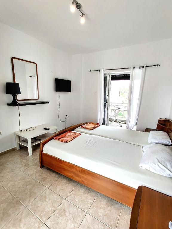 Postel nebo postele na pokoji v ubytování FLOGITA - 5 Beautiful Apartments