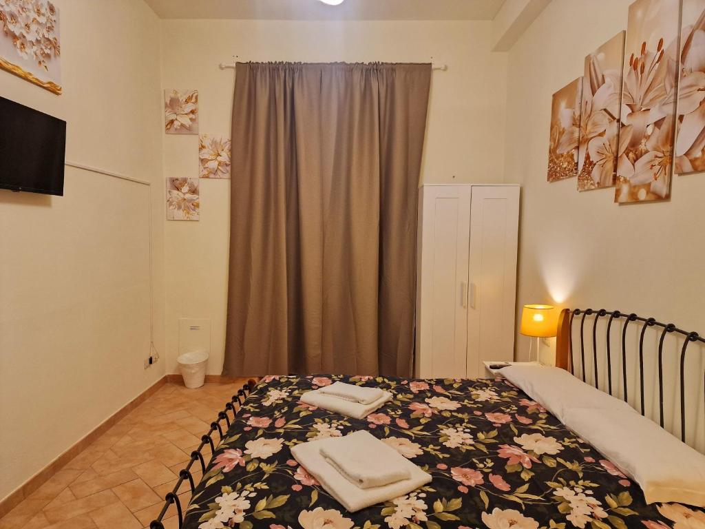 Łóżko lub łóżka w pokoju w obiekcie Au jardin de Florence