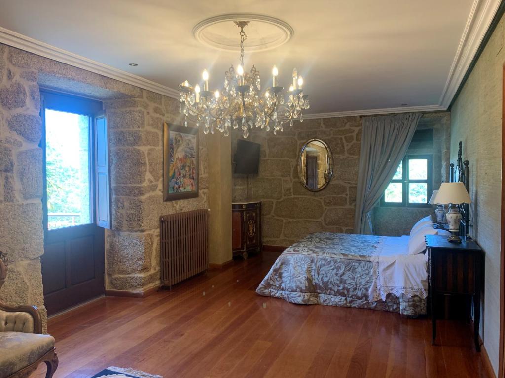 Postel nebo postele na pokoji v ubytování Hotel Rústico San Jaime