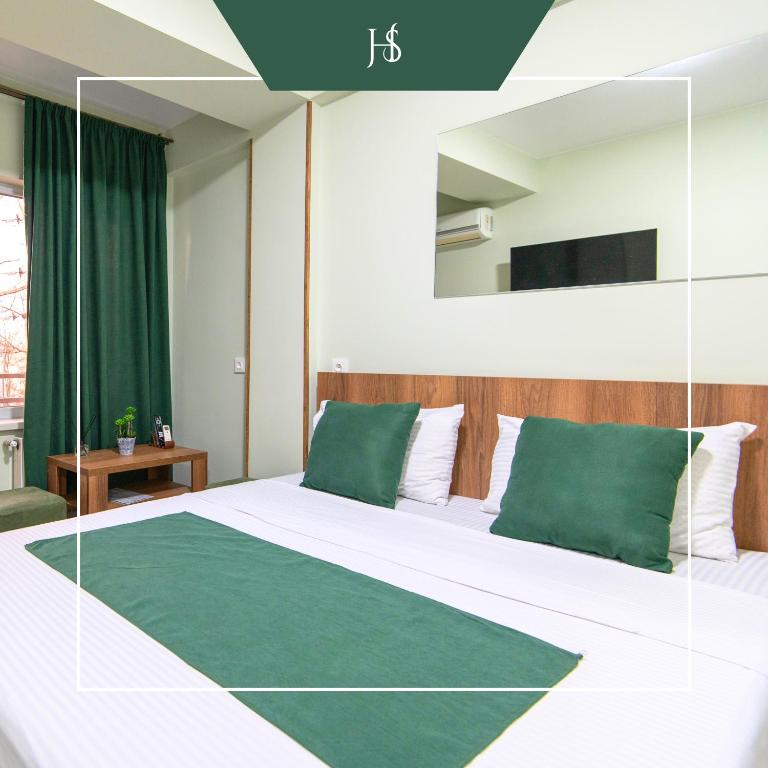 Postel nebo postele na pokoji v ubytování Hotel Serenity