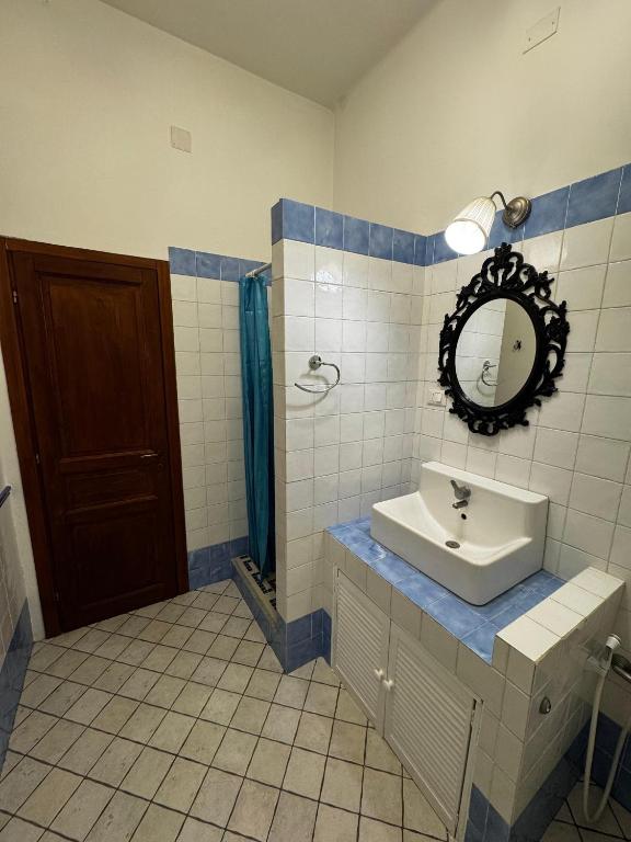 a bathroom with a sink and a mirror at Mezzano B&B in Mezzano