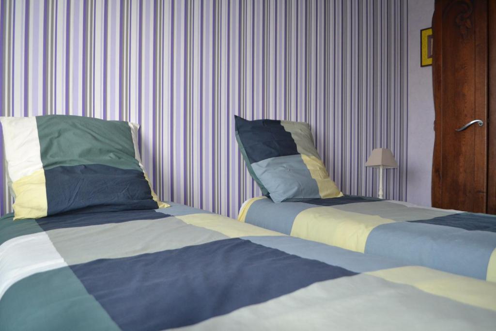 Ένα ή περισσότερα κρεβάτια σε δωμάτιο στο Maison des Marais