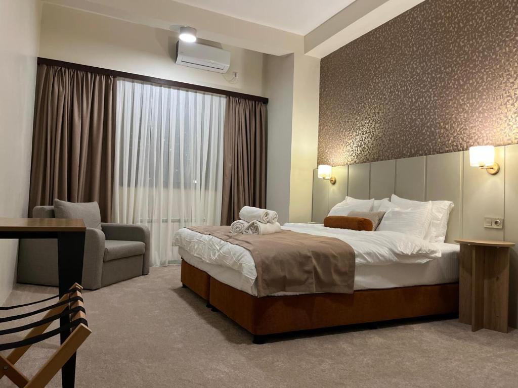 Postel nebo postele na pokoji v ubytování Saffron Boutique Hotel