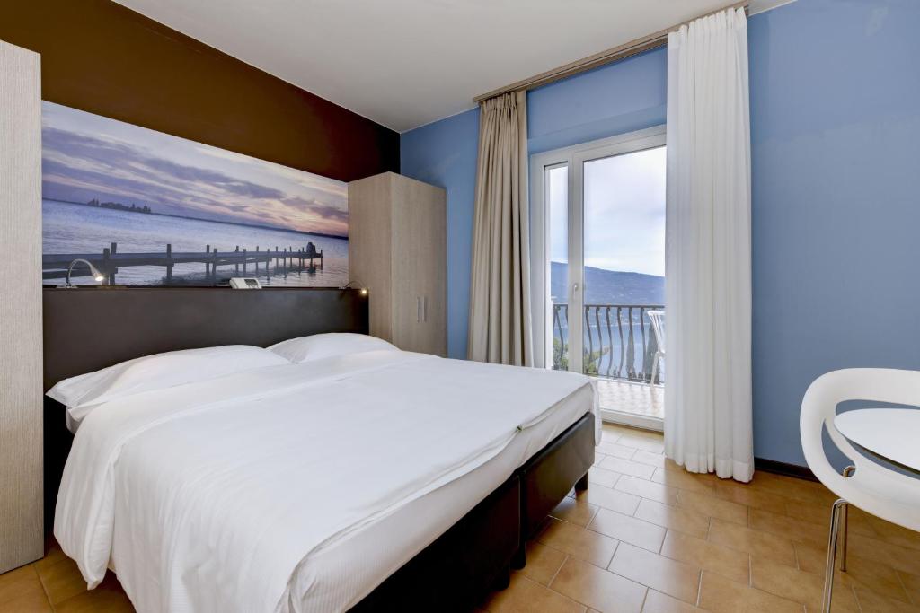 Postel nebo postele na pokoji v ubytování Hotel Bellavista
