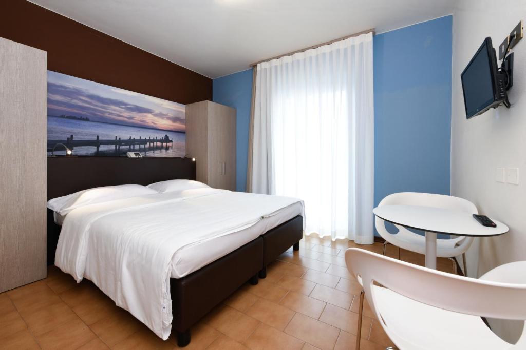 Postel nebo postele na pokoji v ubytování Hotel Bellavista