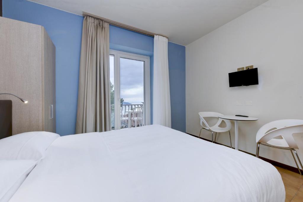 Postel nebo postele na pokoji v ubytování Hotel Bellavista