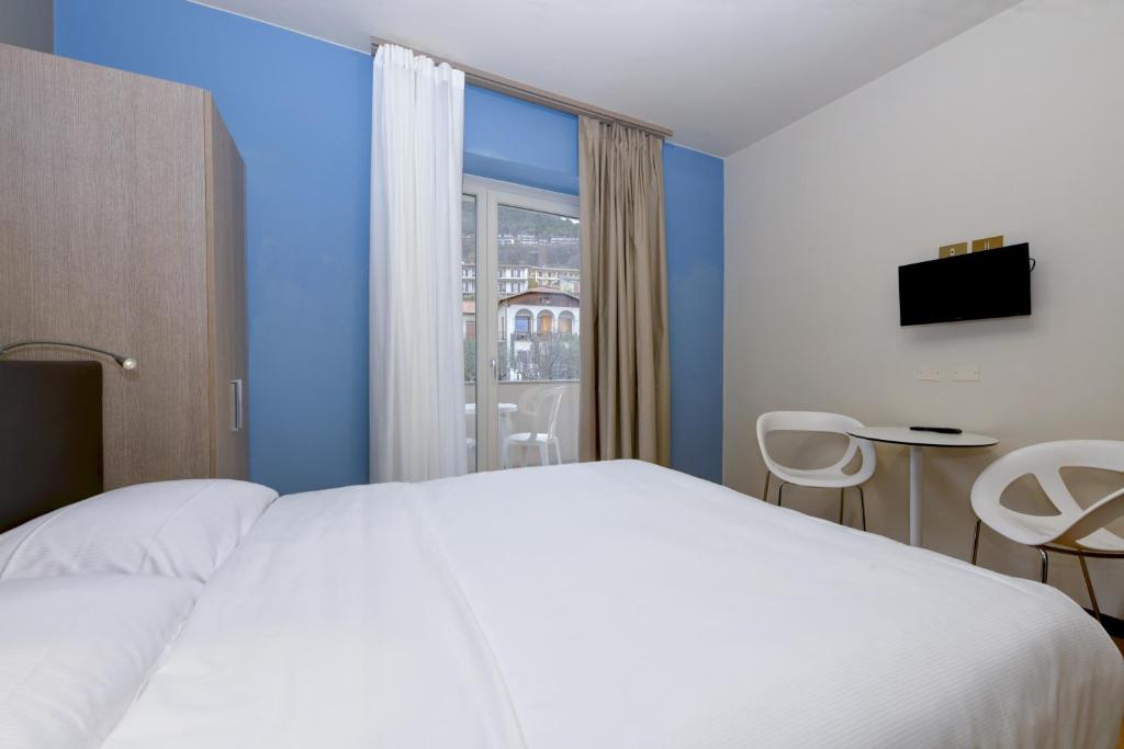 Postel nebo postele na pokoji v ubytování Hotel Bellavista