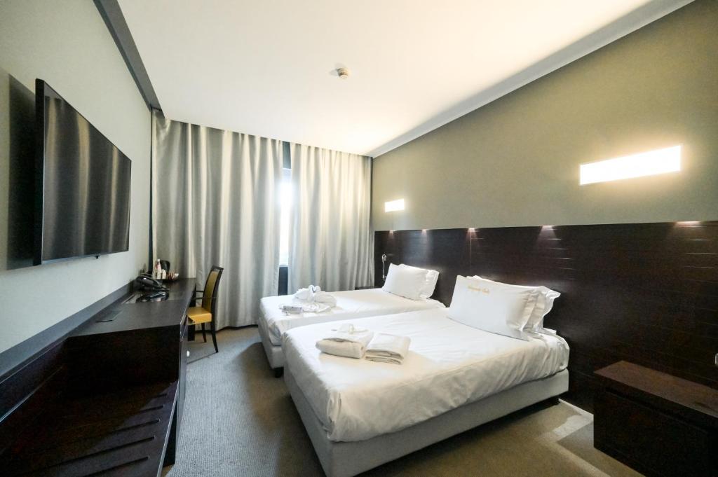 Postel nebo postele na pokoji v ubytování Hotel Selene Pomezia