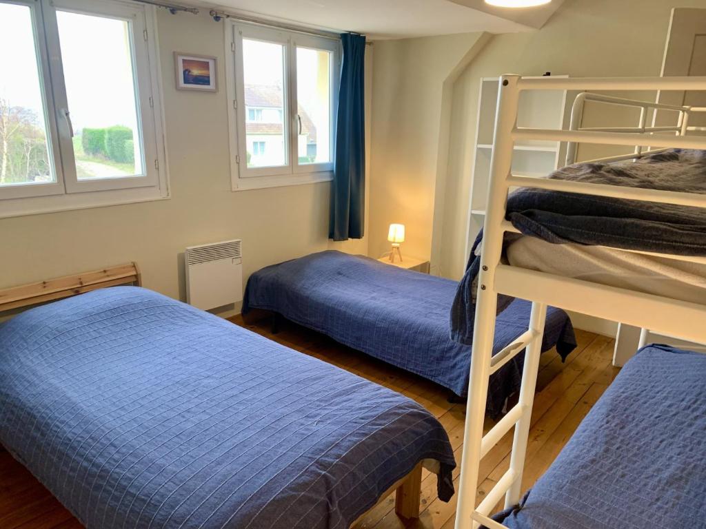 Posteľ alebo postele v izbe v ubytovaní Maison village, 10 pers, proche de la plage
