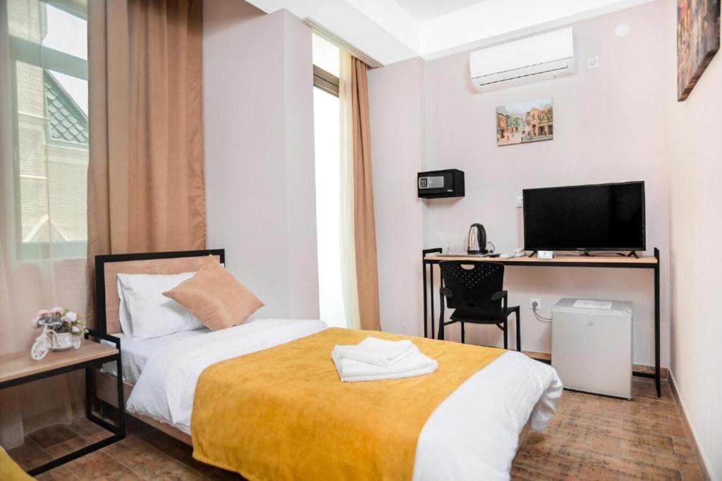 Postel nebo postele na pokoji v ubytování Diuma Hotel