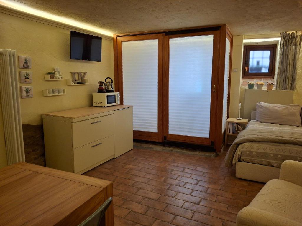 Posteľ alebo postele v izbe v ubytovaní Tavernetta vicino Lago Trasimeno