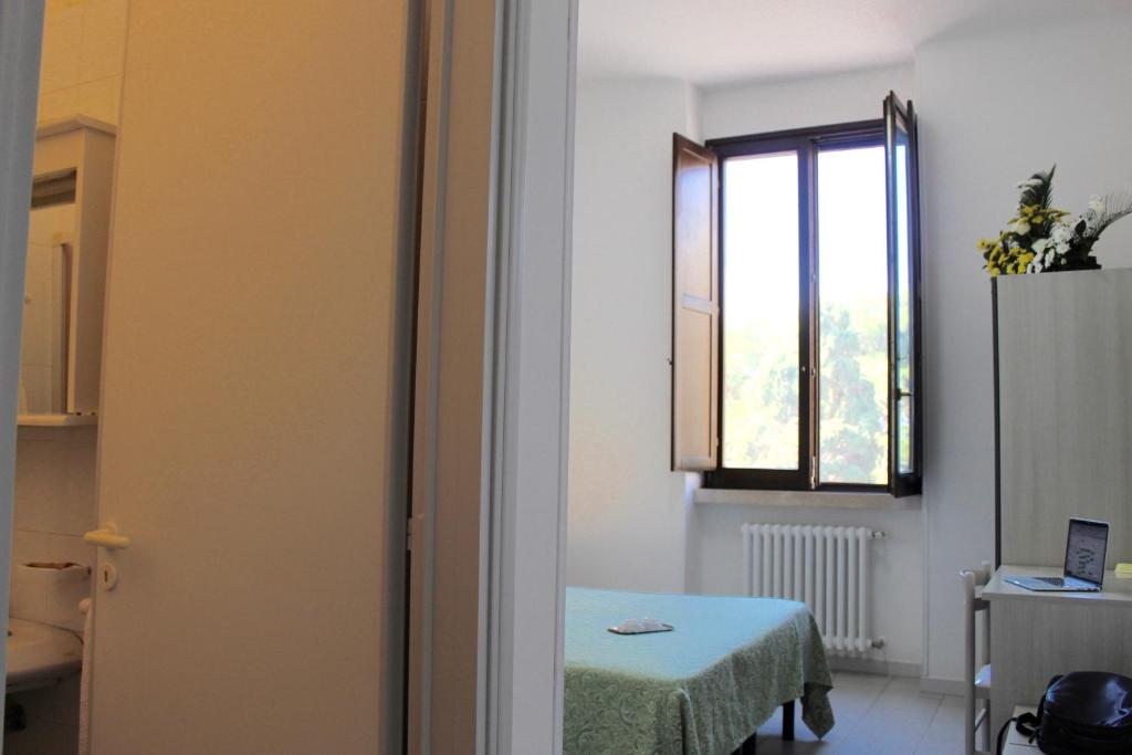 Postel nebo postele na pokoji v ubytování Albergo Del Santuario