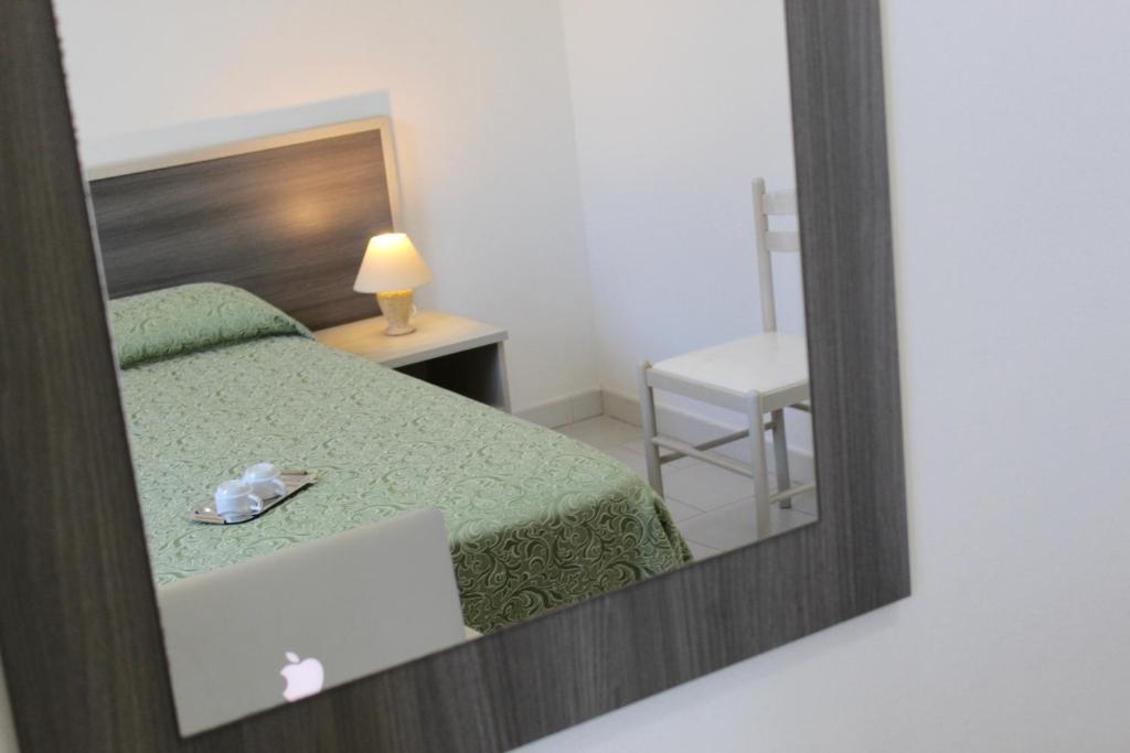 Postel nebo postele na pokoji v ubytování Albergo Del Santuario