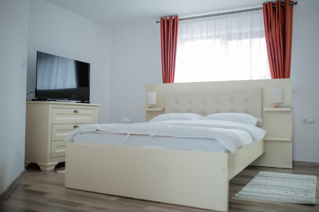 Postel nebo postele na pokoji v ubytování Boierița Home Stay