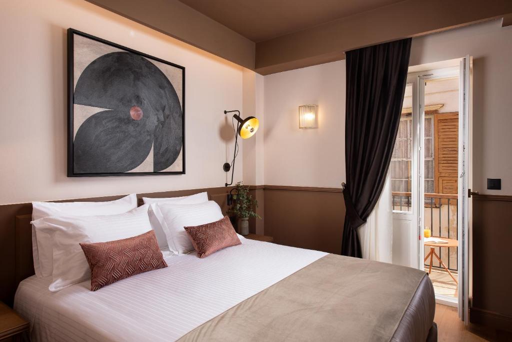 Postel nebo postele na pokoji v ubytování The K Nest Hotel Nafplio