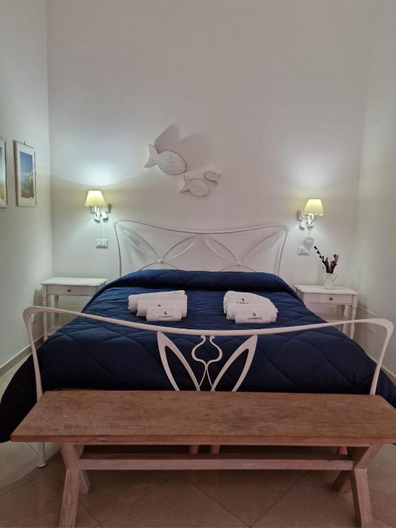 Postel nebo postele na pokoji v ubytování White Suite Polignano 08