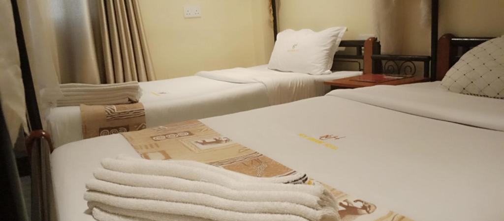 Postel nebo postele na pokoji v ubytování Urbane Hotel Urbane Plaza