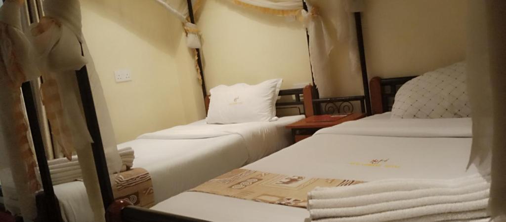 Postel nebo postele na pokoji v ubytování Urbane Hotel Urbane Plaza
