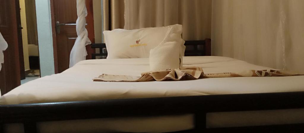 Postel nebo postele na pokoji v ubytování Urbane Hotel Urbane Plaza