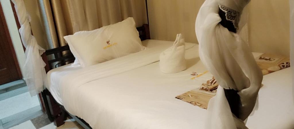 Postel nebo postele na pokoji v ubytování Urbane Hotel Urbane Plaza