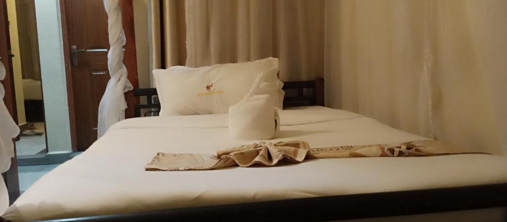 Postel nebo postele na pokoji v ubytování Urbane Hotel Urbane Plaza