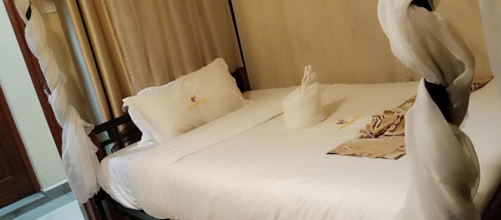 Postel nebo postele na pokoji v ubytování Urbane Hotel Urbane Plaza