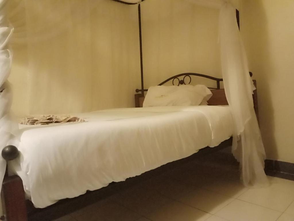 Postel nebo postele na pokoji v ubytování Urbane Hotel Urbane Plaza