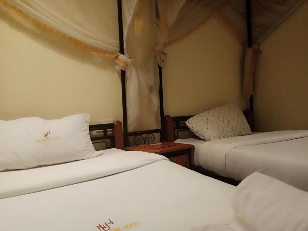 Postel nebo postele na pokoji v ubytování Urbane Hotel Urbane Plaza