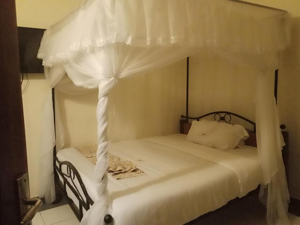 Postel nebo postele na pokoji v ubytování Urbane Hotel Urbane Plaza