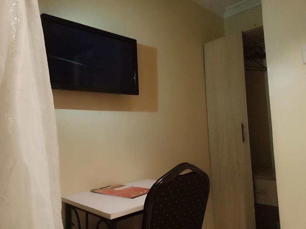 TV a/nebo společenská místnost v ubytování Urbane Hotel Urbane Plaza