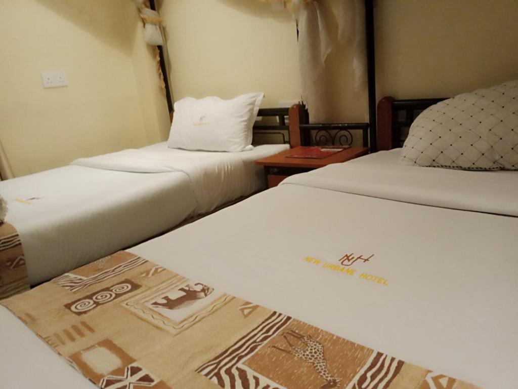 Postel nebo postele na pokoji v ubytování Urbane Hotel Urbane Plaza