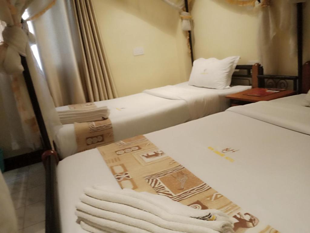 Postel nebo postele na pokoji v ubytování Urbane Hotel Urbane Plaza