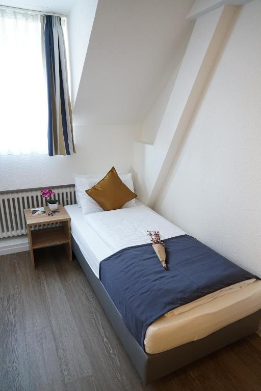 Voodi või voodid majutusasutuse Centra Hotel Winterthur toas