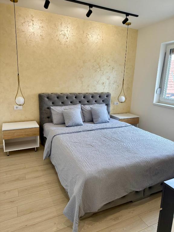 Postel nebo postele na pokoji v ubytování Cvetkovic apartman