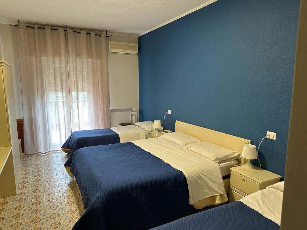 Postel nebo postele na pokoji v ubytování Hotel Costa Jonica