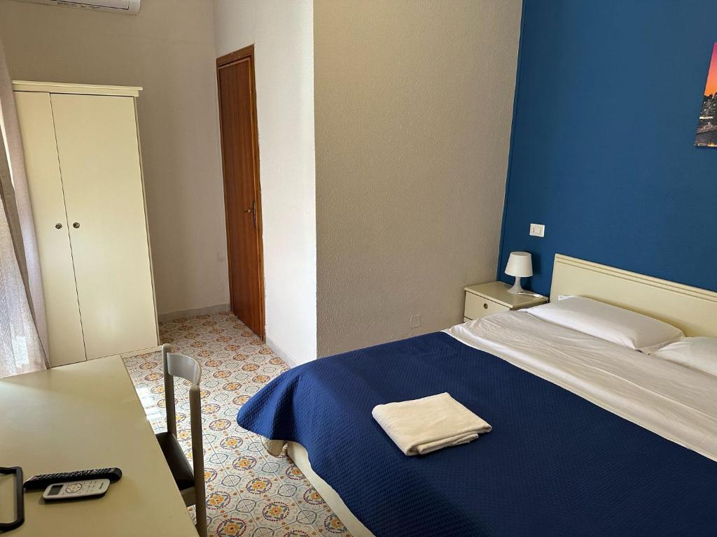 Postel nebo postele na pokoji v ubytování Hotel Costa Jonica