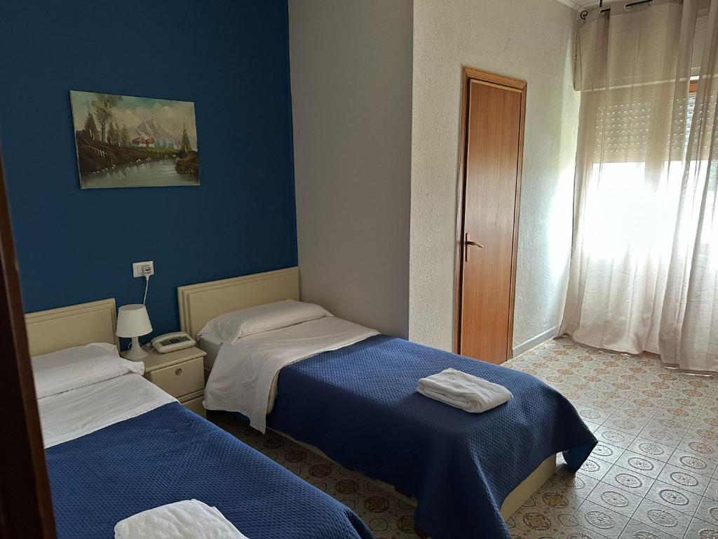 Postel nebo postele na pokoji v ubytování Hotel Costa Jonica