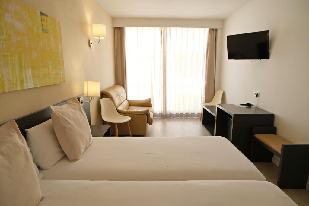 Postel nebo postele na pokoji v ubytování Hotel Marina