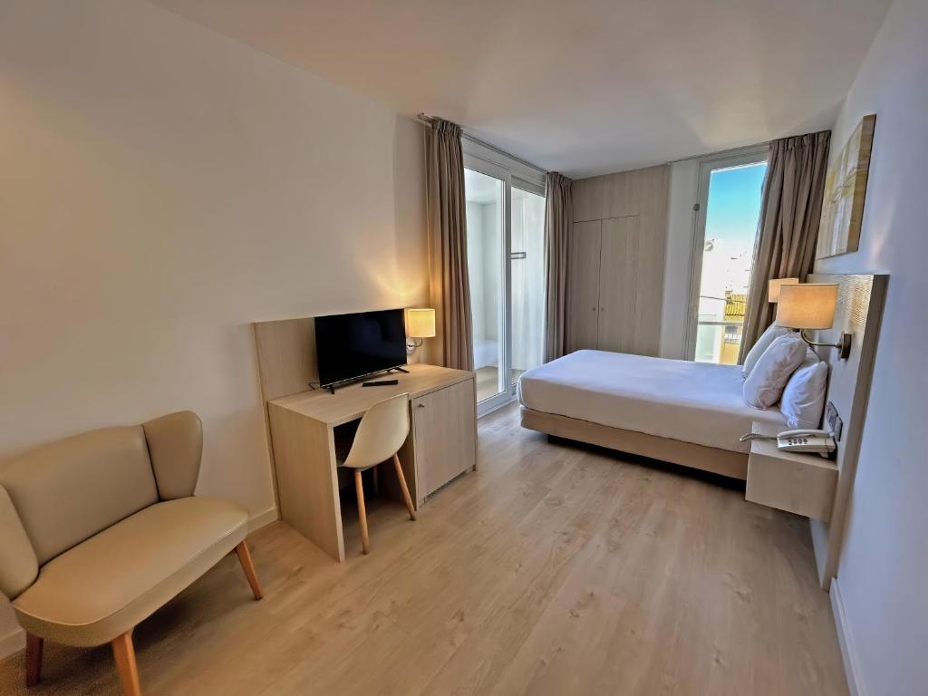 Postel nebo postele na pokoji v ubytování Hotel Marina