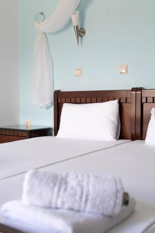 Postel nebo postele na pokoji v ubytování Hotel Alexandros